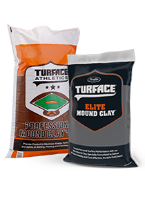 Two bags of Turface mound clay shown side by side. The larger bag is labeled “Turface Professional Mound Clay” with an illustration of a baseball field, and the smaller bag is labeled “Turface Elite Mound Clay.” The packaging is white, orange, black, and gray.