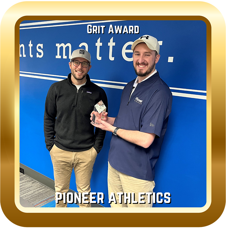 Image of two men with a Grit Award.