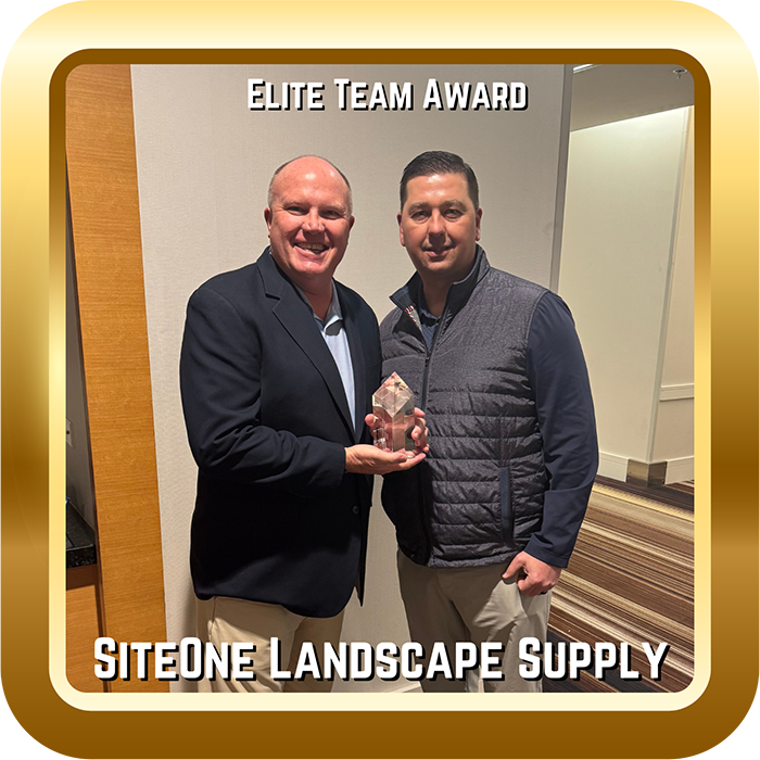 Image of two men with an Elite Team Award.