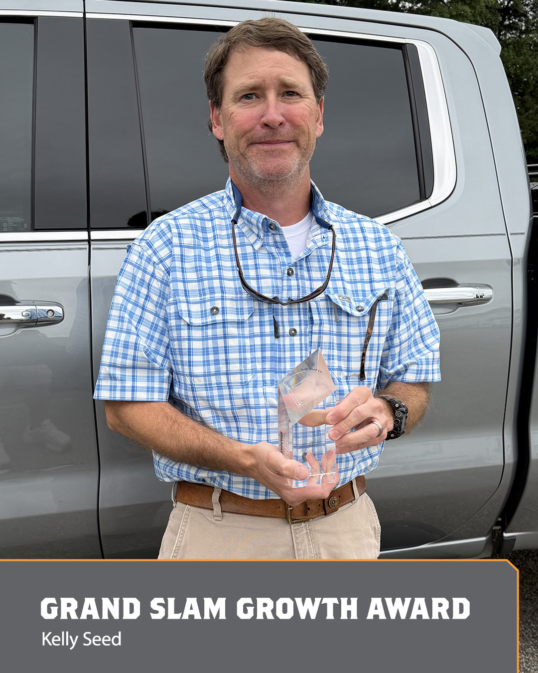 Image of a man holding an Ace Award.