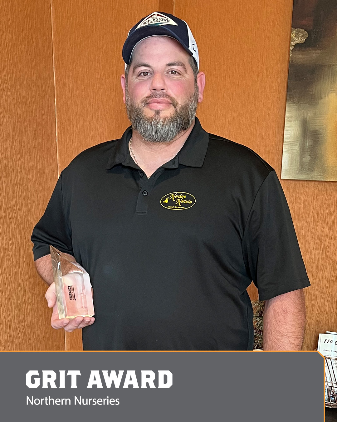 Image of a man holding an Ace Award.